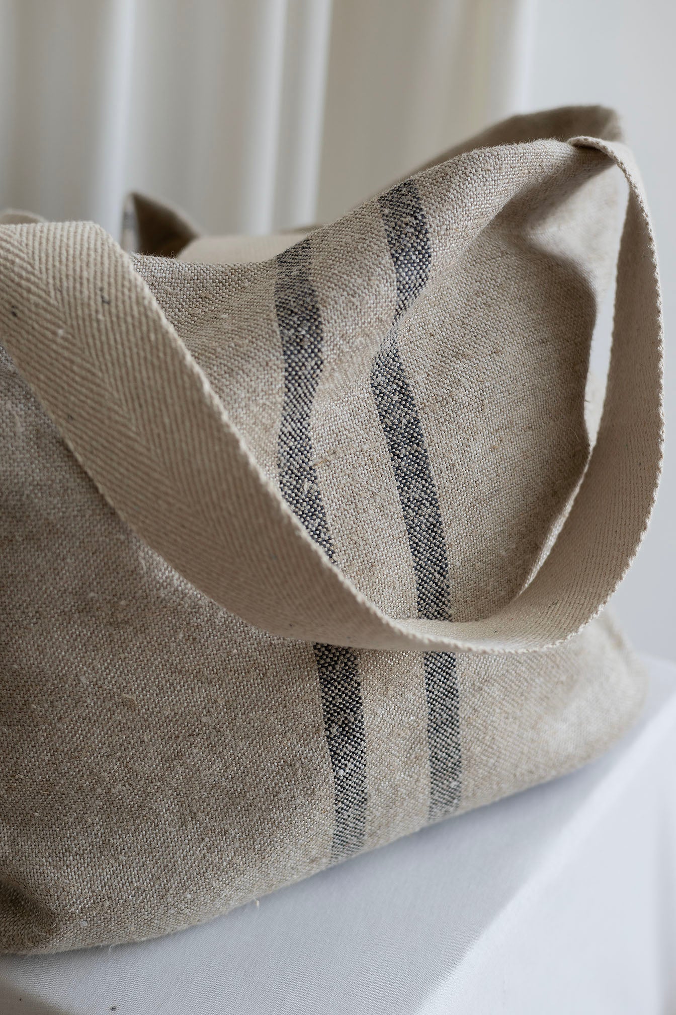Light grey Abundance bag with vertical stripes
