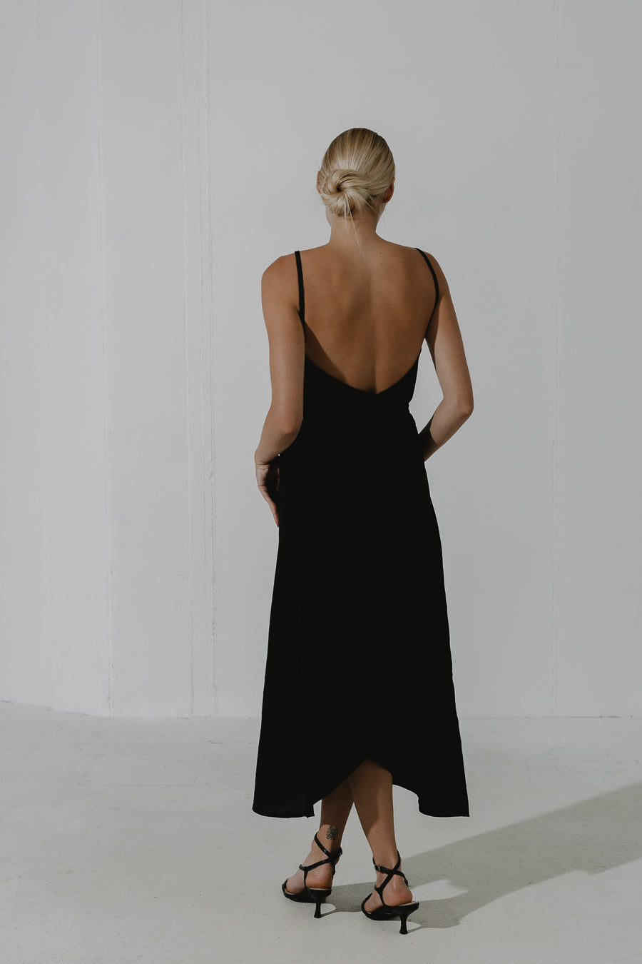 OBSIDIAN Bias-cut linen midi wrap dress with a detachable pouch-bag