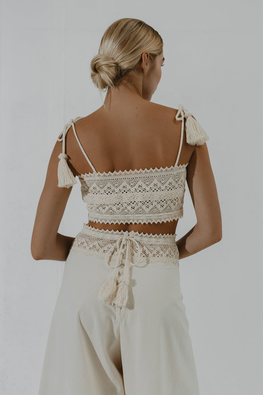 TEFF Wide-leg trousers with layered lace belt and button fastening at the back