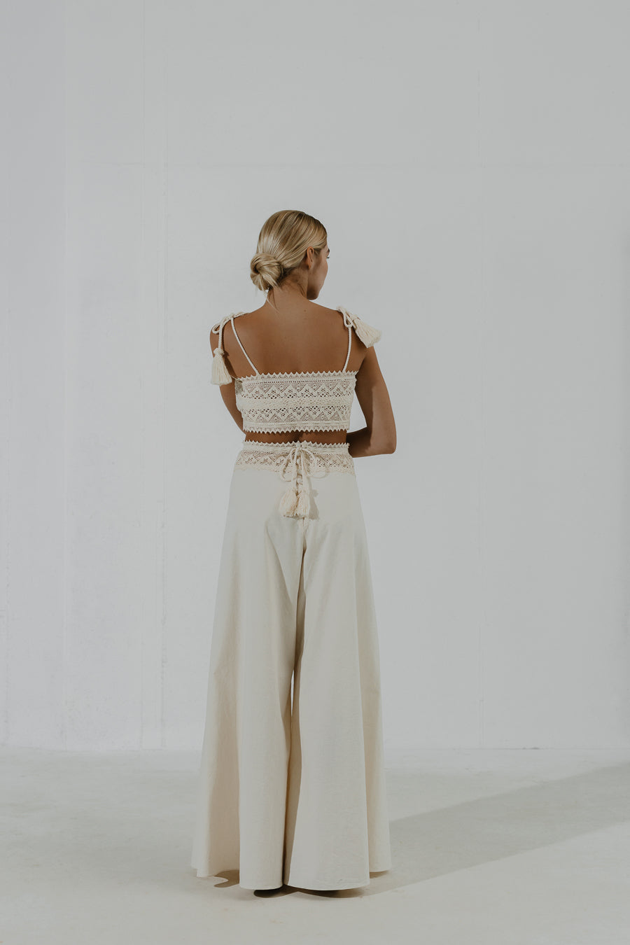 TEFF Wide-leg trousers with layered lace belt and button fastening at the back